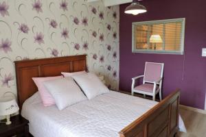 Postel nebo postele na pokoji v ubytování Maison rosalice