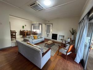 a living room with a couch and a table at 39 Shone GH in Postmasburg