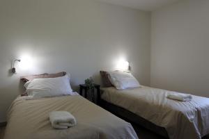 Postel nebo postele na pokoji v ubytování Graine