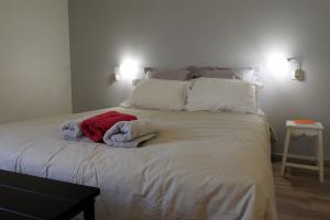 En eller flere senge i et værelse på Ficelle