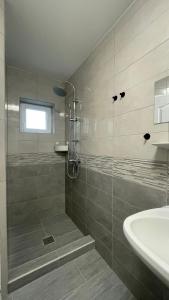 a bathroom with a shower and a sink at KULCSi SZÁLLÁS in Kulcspuszta +30 photos
