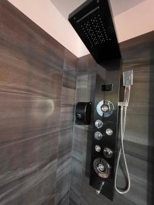 a shower in a bathroom with a shower at Motel Rimouski in Rimouski