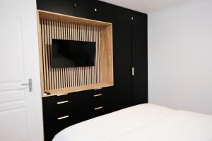 Ένα ή περισσότερα κρεβάτια σε δωμάτιο στο Rouen Gare centre Ménage et linge inclus