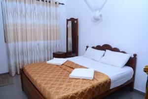 Un pat sau paturi într-o cameră la A&A Homestay