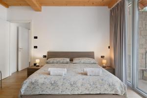 Postel nebo postele na pokoji v ubytování Appartamento Jubilant