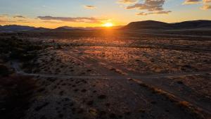 an empty road in the desert at sunset at Tsauchab River Camp in Sesriem +149 photos