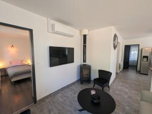 TV a/nebo společenská místnost v ubytování Chez anita