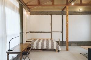 Postel nebo postele na pokoji v ubytování Obi house B2離れ