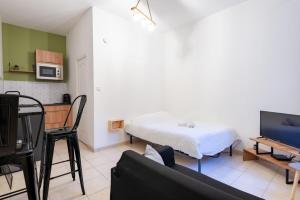 TV a/nebo společenská místnost v ubytování Le théâtre 2