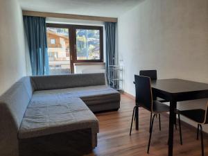 a living room with a couch and a table at Apartments Hermann Arnold in Sölden