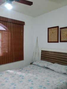 En eller flere senge i et værelse på Casa de praia S Pedro Aldeia!