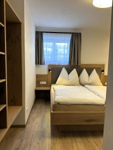 Ένα ή περισσότερα κρεβάτια σε δωμάτιο στο The HIDDEN Apartment