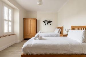 a bedroom with two beds and a window at Bonnington House - Elie in Elie