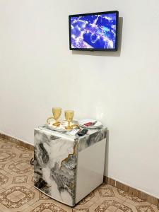 TV a/nebo společenská místnost v ubytování Quarto privado no centro 103 + 6 fotografií