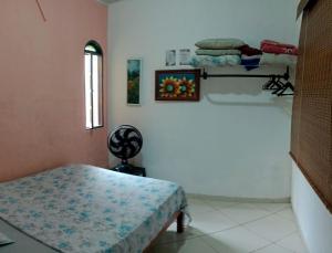 En eller flere senge i et værelse på Casa de praia S Pedro Aldeia! + 10 billeder