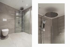 a bathroom with a shower and a toilet at Premium Penthouse in Tromsø - Northern lights, City, Sea & Mountain view in Hjorten +28 photos