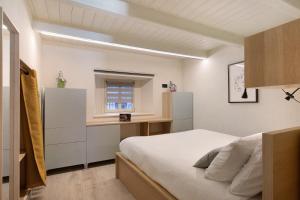 Postel nebo postele na pokoji v ubytování La Maison de Ida - Centro Storico