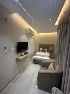 Ένα ή περισσότερα κρεβάτια σε δωμάτιο στο أوان ريزدنس Awan Residence