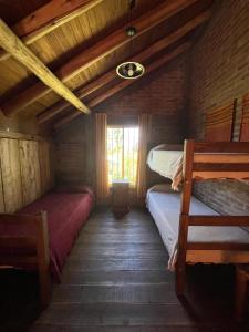 En eller flere senge i et værelse på Quinta Santiago