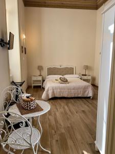 Postel nebo postele na pokoji v ubytování Domus Antica