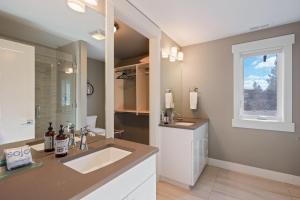 a large bathroom with a sink and a window at Hillside Haven in Bend +31 photos