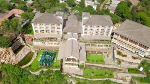 an aerial view of a large building with a pool at Noora Resort 