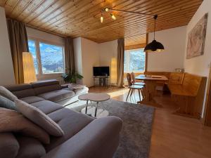 a living room with a couch and a table at Miraflor Carmen - Arosa Holiday in Arosa