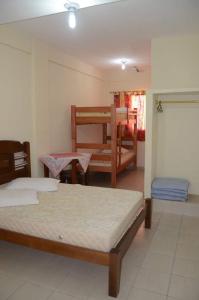 Ένα ή περισσότερα κρεβάτια σε δωμάτιο στο Colônia de Férias da Federação Têxtil do Estado de São Paulo