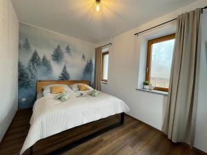 Postel nebo postele na pokoji v ubytování Apartmány pod Štěpánkou