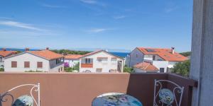 a view of a city from a balcony with houses at Nereo in Mali Lošinj