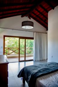 Ένα ή περισσότερα κρεβάτια σε δωμάτιο στο Casamar Itacimirim +50 φωτογραφίες