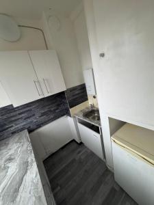 Kuchyň nebo kuchyňský kout v ubytování Apartment Centrum