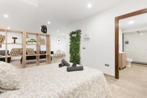 En eller flere senge i et værelse på Apt Buendía Aeropuerto Málaga Playa