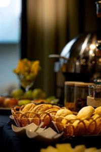 a table with baskets of food on a table at Aparthotel Green Concrete - Free Beach Bus in Świnoujście