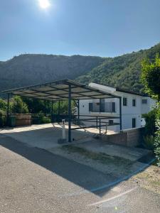 a parking lot with a building with a roof at Villa Sale Buna in Mostar