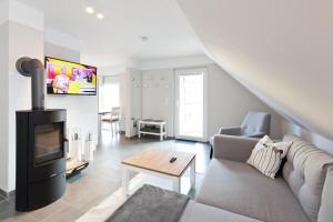 TV a/nebo společenská místnost v ubytování unter den Kiefern 98 OG