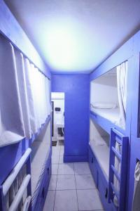 Ένα ή περισσότερα κρεβάτια σε δωμάτιο στο Kasa Hostel Karaokê