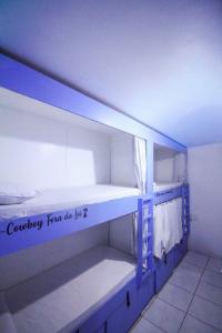 Ένα ή περισσότερα κρεβάτια σε δωμάτιο στο Kasa Hostel Karaokê +31 φωτογραφίες