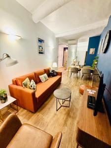 a living room with a couch and a table at Coeur Vieux Nice - Place Rossetti in Nice