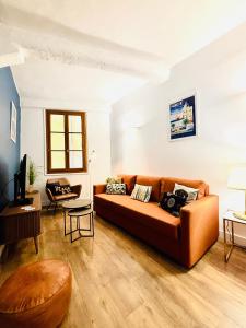 a living room with a couch and a table at Coeur Vieux Nice - Place Rossetti in Nice