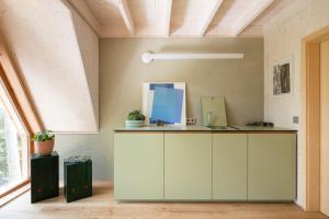 a room with a white cabinet and a window at Il Pino in Tarvisio