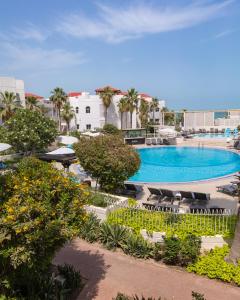 an overhead view of a pool at a resort at Argan Al Bidaa Hotel and Resort , Kuwait in Kuwait