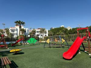 a playground with several slides at Argan Al Bidaa Hotel and Resort , Kuwait in Kuwait