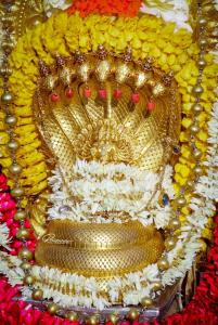 a close up of a gold crown on a display at Sri Durga Residency in Subrahmanya