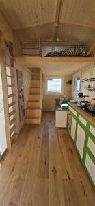 a kitchen and living room in a tiny house at Tiny House Reichle in Boms