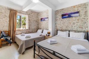Ένα ή περισσότερα κρεβάτια σε δωμάτιο στο Gkountis Apartments Retreat +137 φωτογραφίες