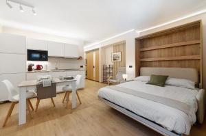 Ένα ή περισσότερα κρεβάτια σε δωμάτιο στο Madesimo Ski Suite