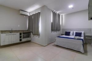 Postel nebo postele na pokoji v ubytování GoldMen Express Campos Goycatazes + 7 fotografií