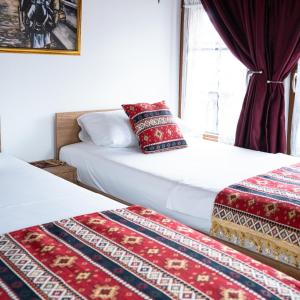 Ένα ή περισσότερα κρεβάτια σε δωμάτιο στο Hotel Ari Old Town