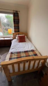 En eller flere senge i et værelse på Beautiful Highland Sanctuary